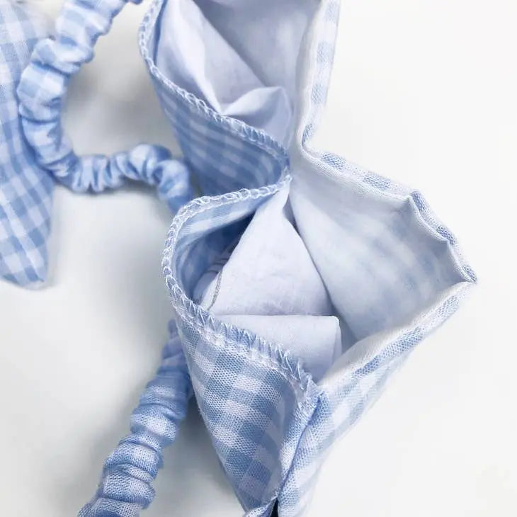 Masque pour les yeux en tissu à carreaux bleu, conçu pour relaxation et apaisement avec graines de lin bio.