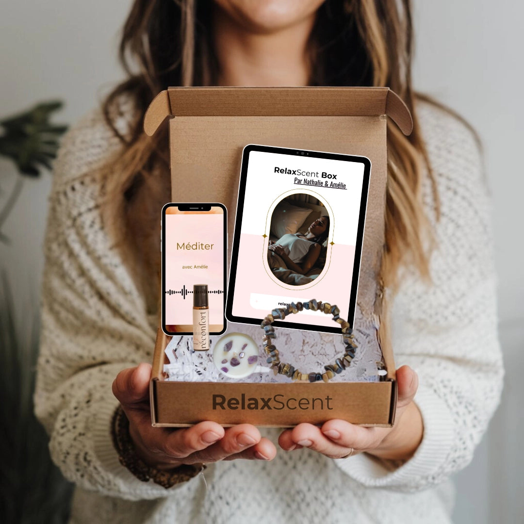 RelaxScent Box - Une box bien-être pour femme, conçue pour offrir un moment de relaxation et de sérénité. Comprend un bracelet en pierres naturelles, un roll-on d’huiles essentielles, une méditation guidée, et un ebook bien-être. Idéal pour les femmes stressées ou les mamans épuisées cherchant à lâcher prise