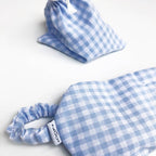 Masque yeux chauffant réfrigérant en tissu à carreaux bleus, conçu pour la relaxation et le bien-être des yeux.